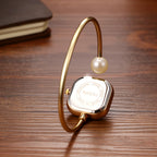 Elegant women's watch, featuring a simulated quartz square case, bar markers, and a bracelet design with imitation pearl embellishments; suitable for all seasons and professional settings